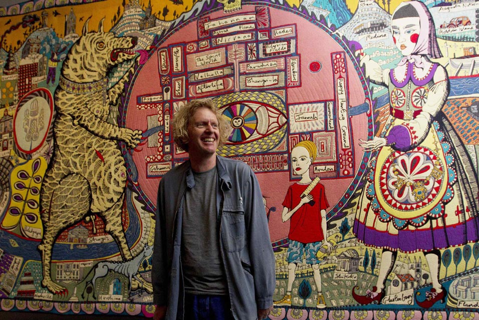 http://www.allartnews.com/wp-content/uploads/2011/10/Artist-Grayson-Perry-poses-for-photographers-in-front-of-his-work-Map-of-Truths-and-Beliefs2.jpg