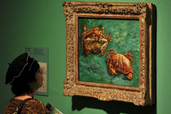 A visitor views a painting by the Dutch artist Vincent Van Gogh entitled Two Crabs 585x391 Royal Academy of Arts Stages a Landmark Exhibition of the Work of Vincent van Gogh