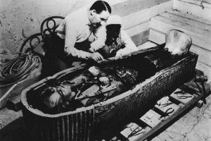 Howard Carter the archaeologist who discovered King Tutankhamuns tomb examining King Tuts sarcophagus 300x200 Tests Show King Tutankhamen Died from Malaria Infection, Study Says