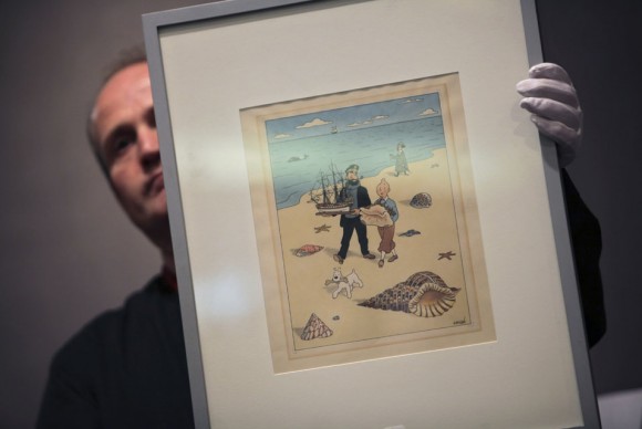 A porter displays a watercolor named Tintin and the Sea Shells 580x388 Comic Hero Tintin Nets $1.3 Million in Auction at Drouot Montaigne