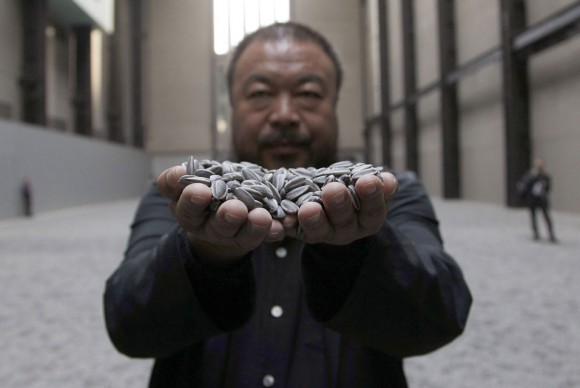 Chinese artist Ai Weiwei throws porcelain sunflower seeds 580x388 Chinese Avant Garde Artist Ai Weiwei Under House Arrest, Not Allowed to Travel to Shanghai