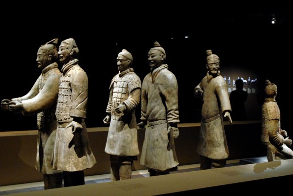 A security man in silhouette stands guard at the exhibition of The First Emperor Chinas entombed warriors 580x388 Entombed for Over 2000 Years, Warriors of Chinas First Emperor, Arrive in Sydney