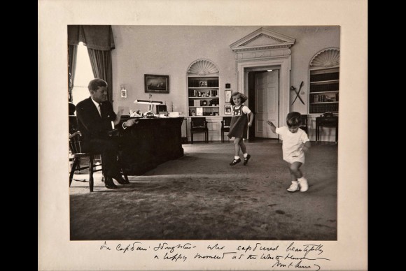 President John F. Kennedy being visited by his children Caroline and John Jr 580x388 Trove of John F. Kennedy Photos Sold for Over $150,000 at Auction in New York City