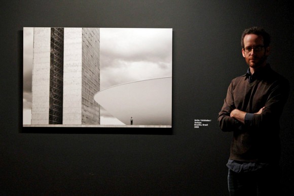 US photographer Bernie DeChant poses next to his artwork Units 580x388 Valencian Institute of Modern Art Shows Photographs by Bernie DeChant: Brazil and Beyond