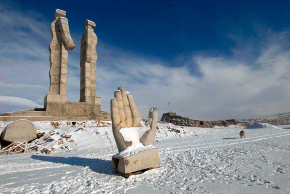 the monument that features a divided human figure with one half extending a hand to the other half 580x388 Debate in Turkey Over Armenia Monument: Modern Art or a Blight on the Landscape?