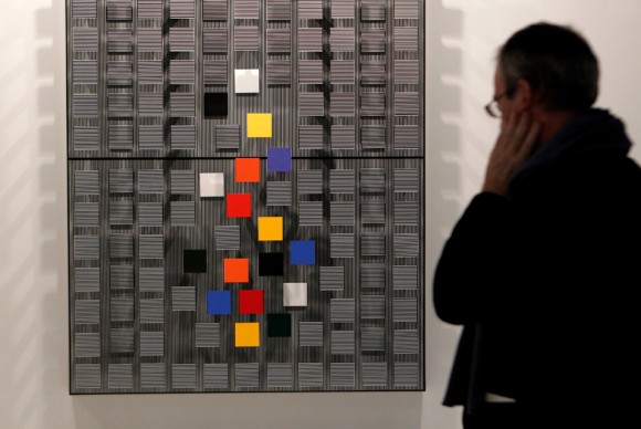 A man looks at an artwork by Venezuelan artist Jesus Soto at a section of Latin American Art 580x388 Following Improved Results, ARCOmadrid 2011 Anticipates a Change of Trend