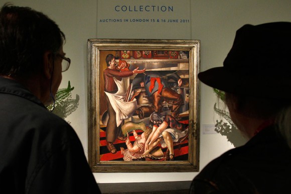 Visitors look at Stanley Spencers Workmen in the House during a photo call at Sothebys in London 580x388 Sothebys Three Part Single Owner Evill/Frost Sale Closes with Final Total of $69,343,051
