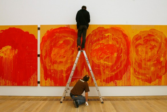 Two people install the painting Roses by U.S. artist Cy Twombly 580x388 Cy Twombly, Known for His Large Scale, Freely Scribbled, Calligraphic Style, Dies at 83