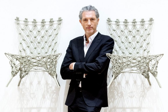 Dutch designer Marcel Wanders poses between two of his Knotted Chairs 580x388 First ever large scale presentation of Marcel Wanders’ work opens at Stedelijk Museum