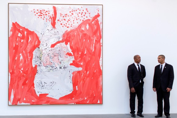Men stand next to the 2013 work Blear Elf Will by German artist Georg Baselitz 580x388 Exhibition of new paintings by Georg Baselitz opens at Gagosian Gallery in London